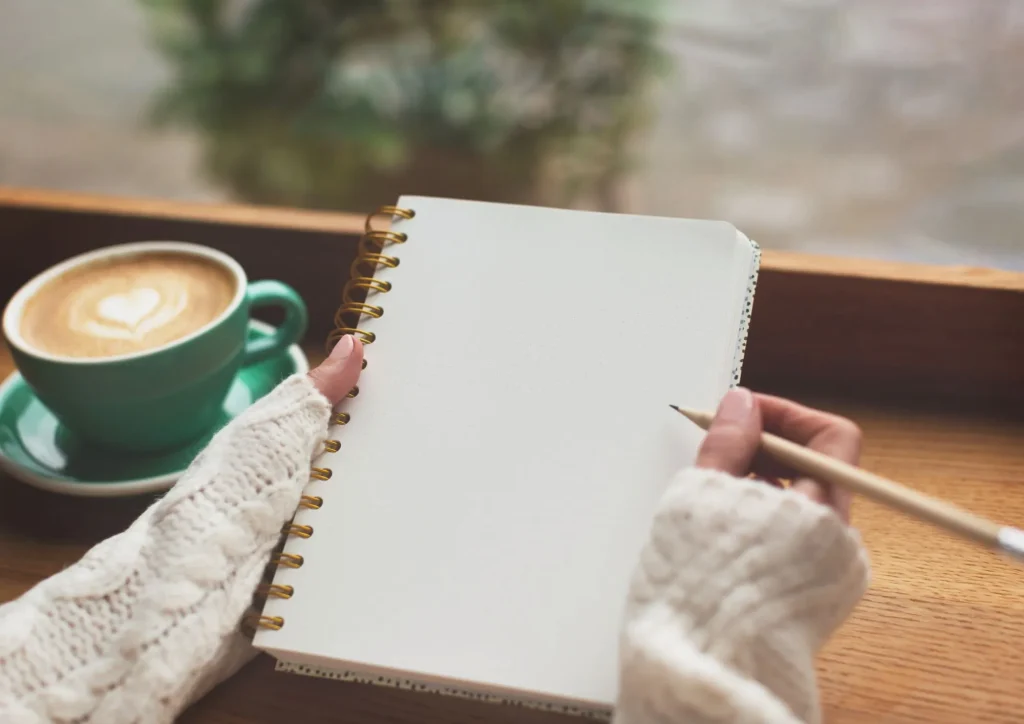 hands diary writing self reflection