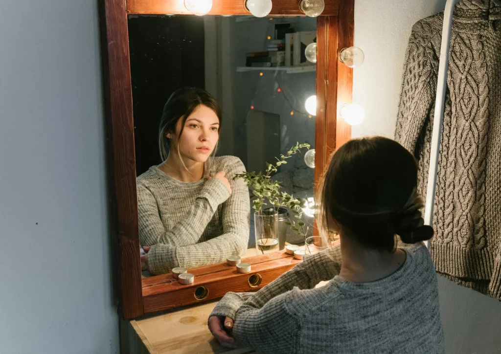 woman looking confused mirror