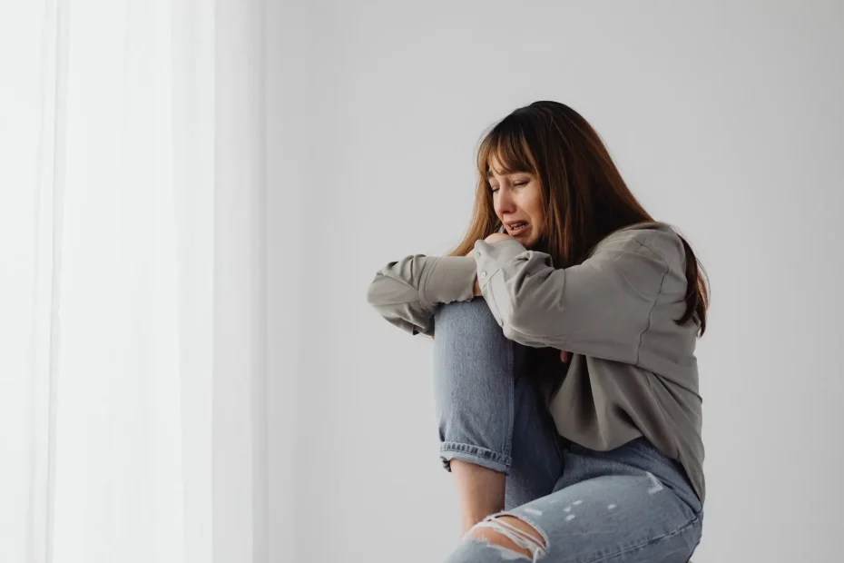 woman feeling helpless and she cries